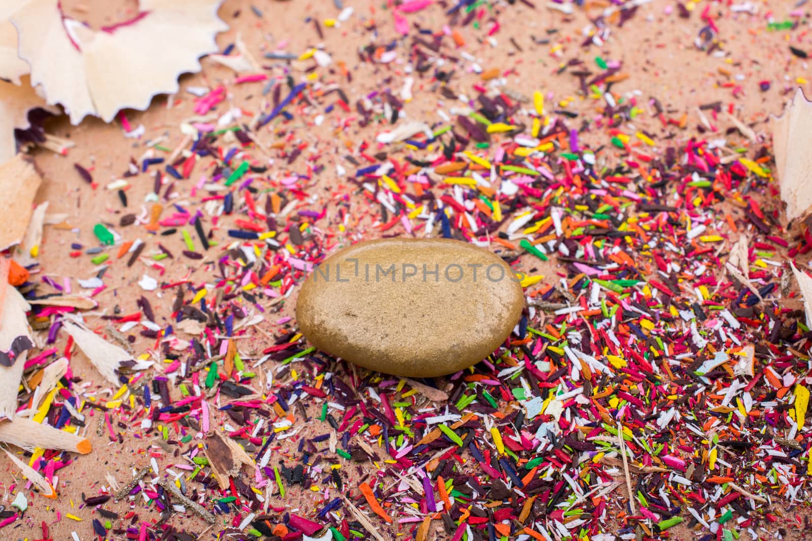 Little gold color stone on with a background