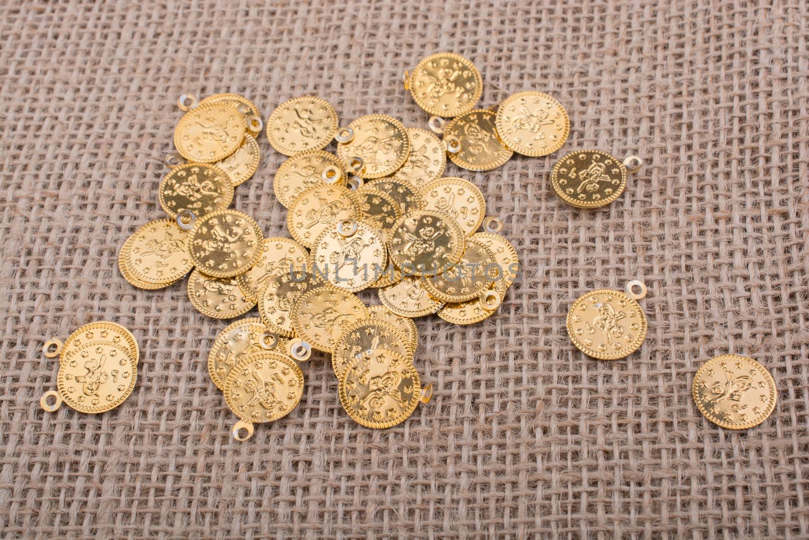 Plenty of fake gold coins are on canvas
