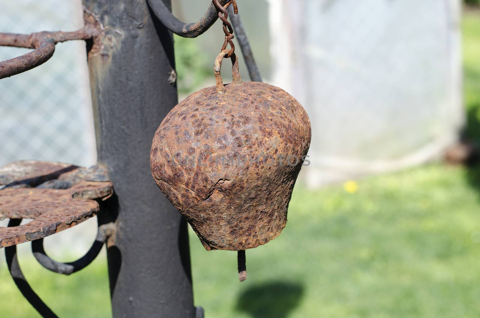 Old bell at the nature as a backdrop