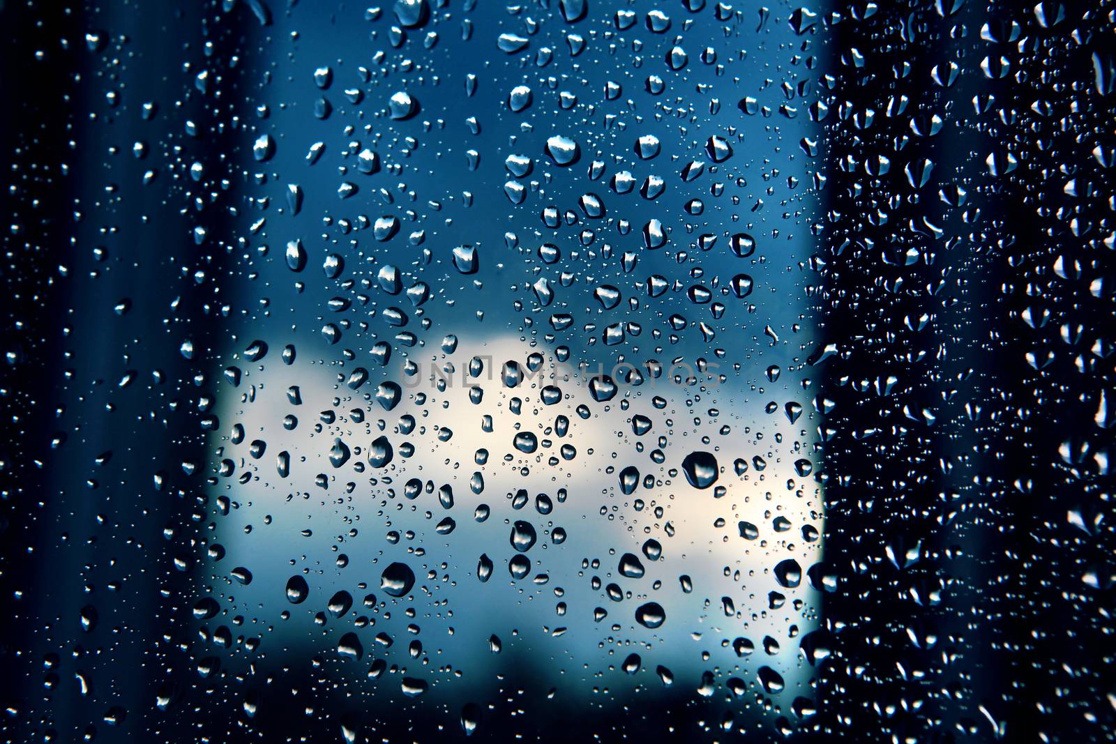 rain droplets on window at twilight