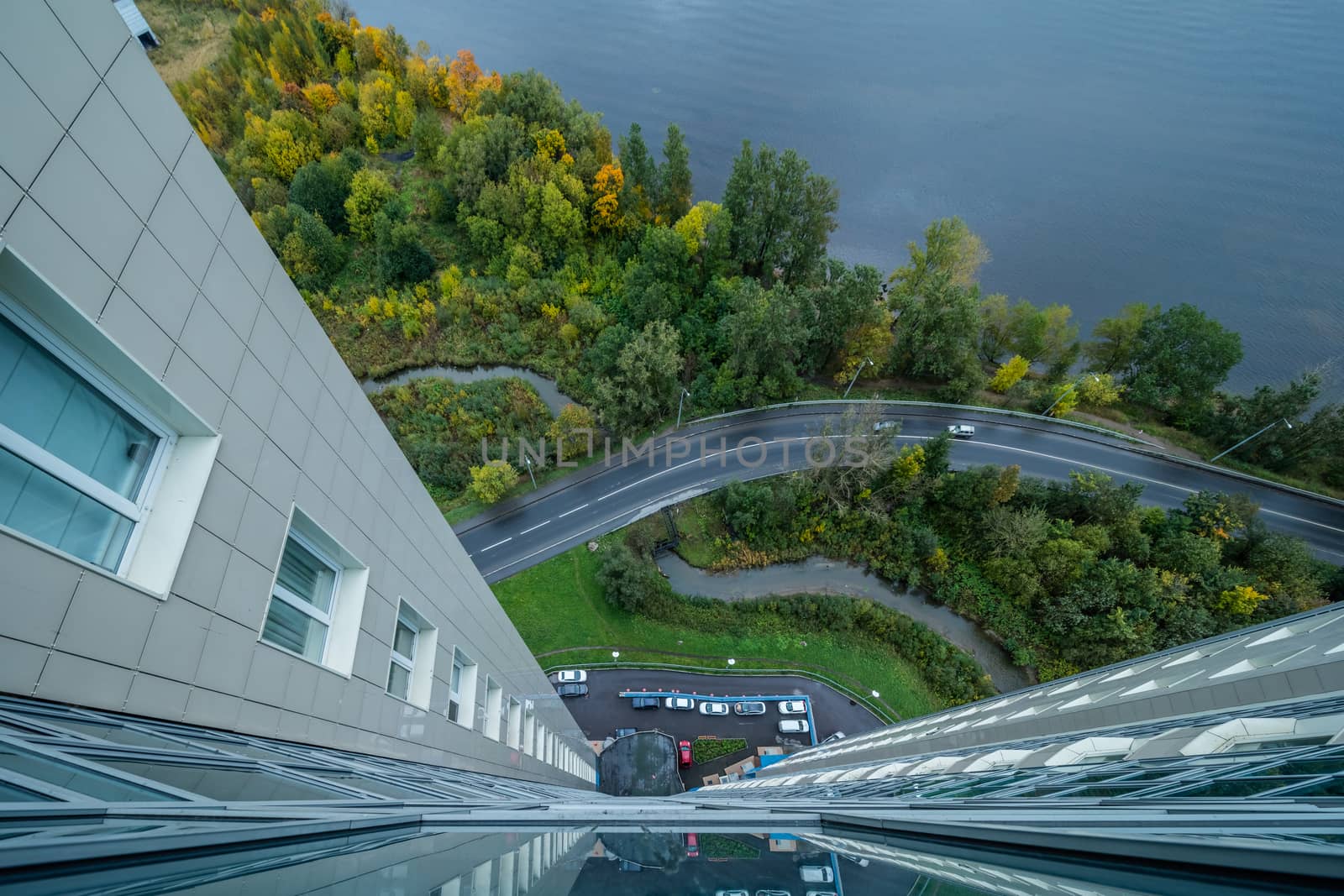 View down from skyscraper on river and road with cars
