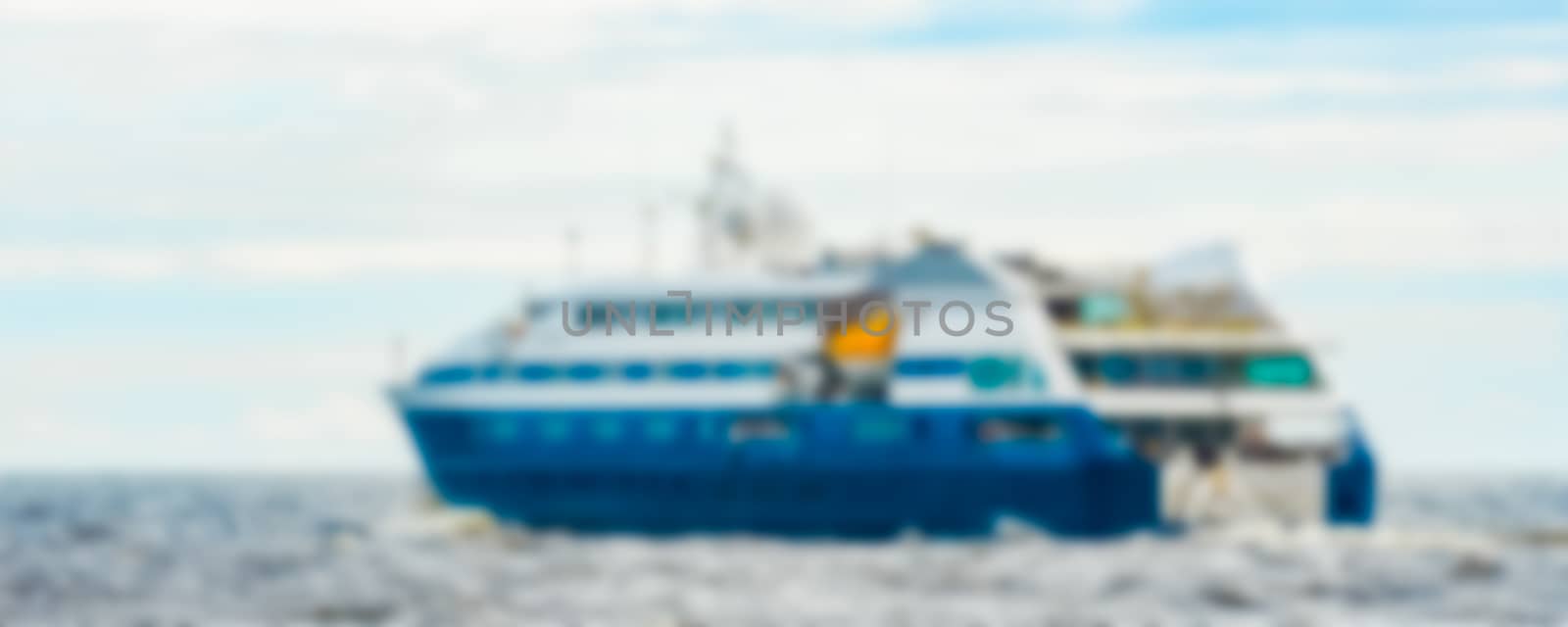 Blue passenger ship - blurred image by sengnsp