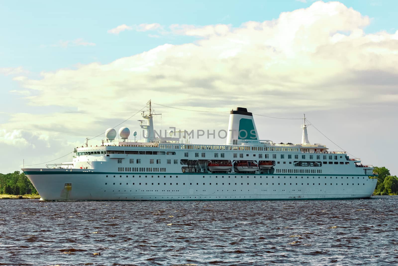 White cruise liner in Riga city. Tour travel and spa services