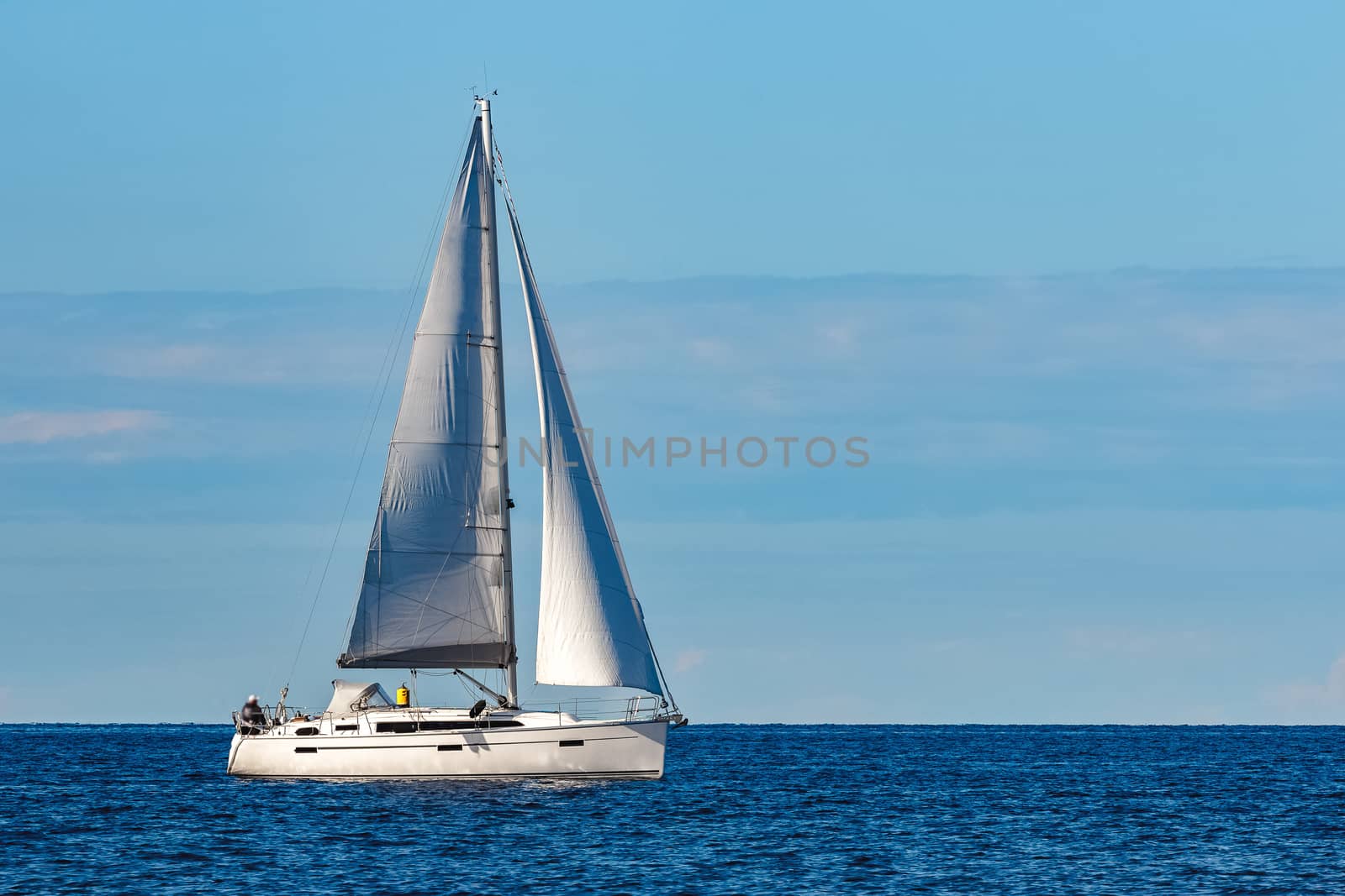 Beautiful white sailboat in a travel by Riga. Summer journey