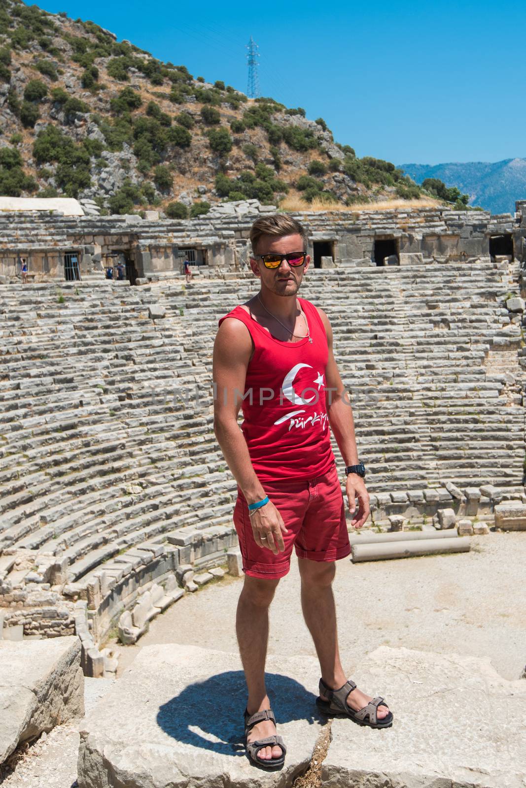 Young man at theatre in Myra ancient city of Antalya in Turkey.