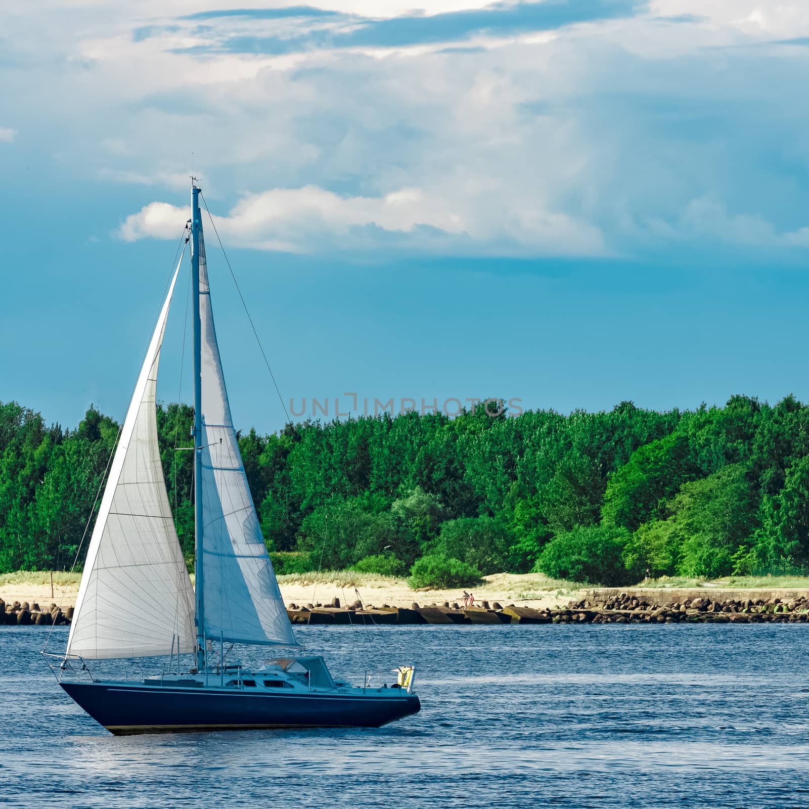 Blue sailboat in the travel by Europe. Sea journey