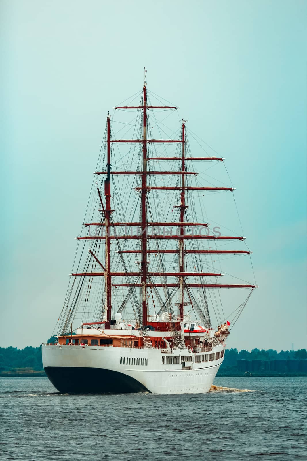 Big white sailing ship with three mast moving to the Riga port