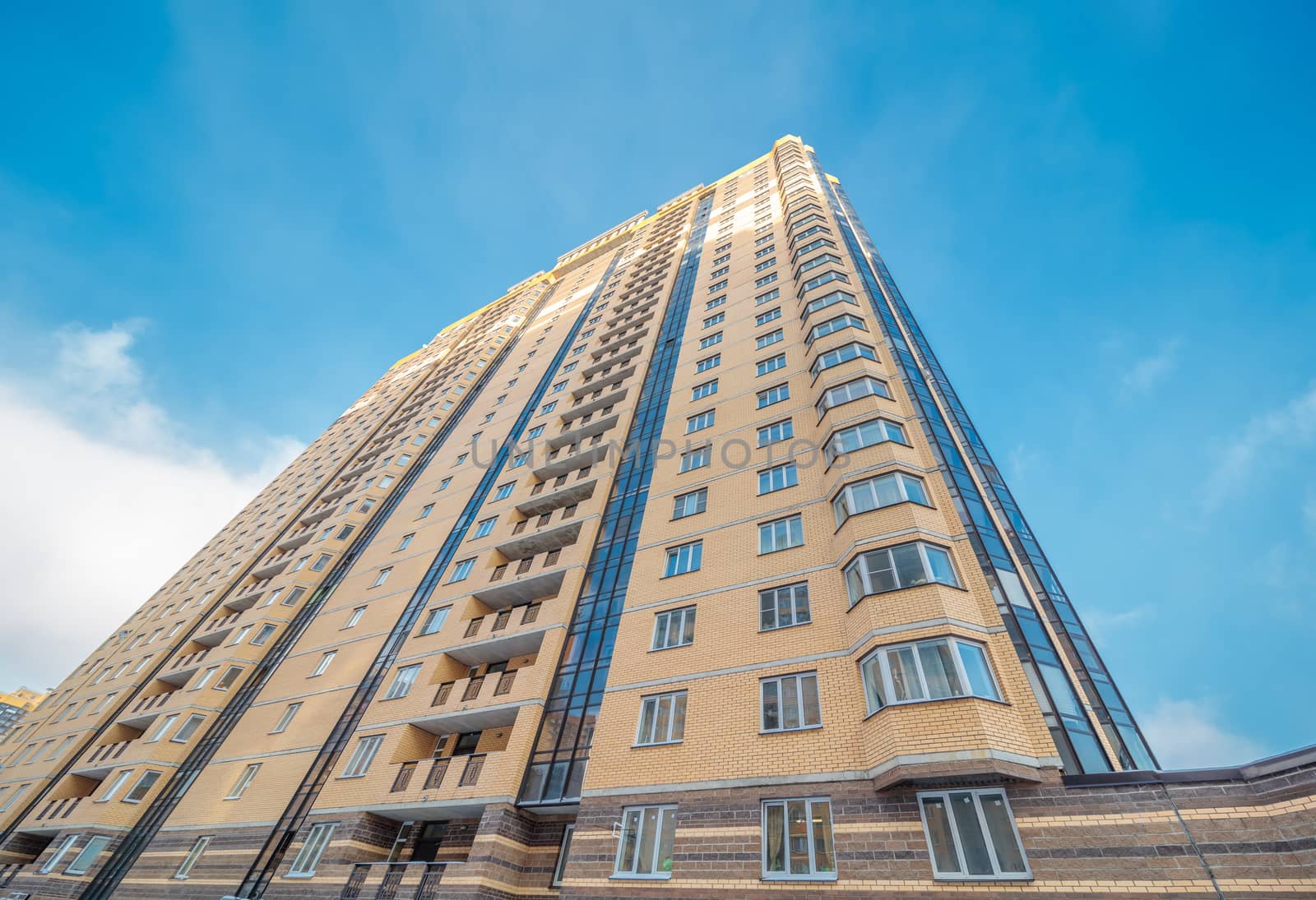 Modern building exterior low angle view with blue sky