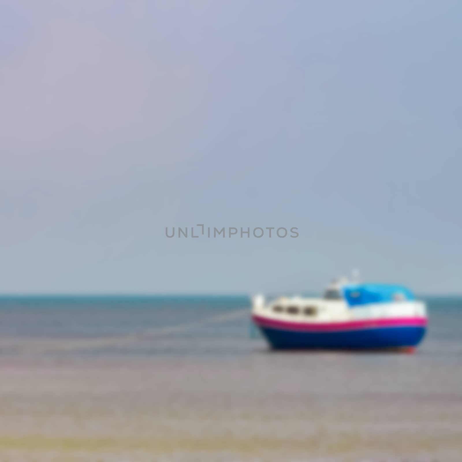 Blue passenger ship - blurred image by sengnsp
