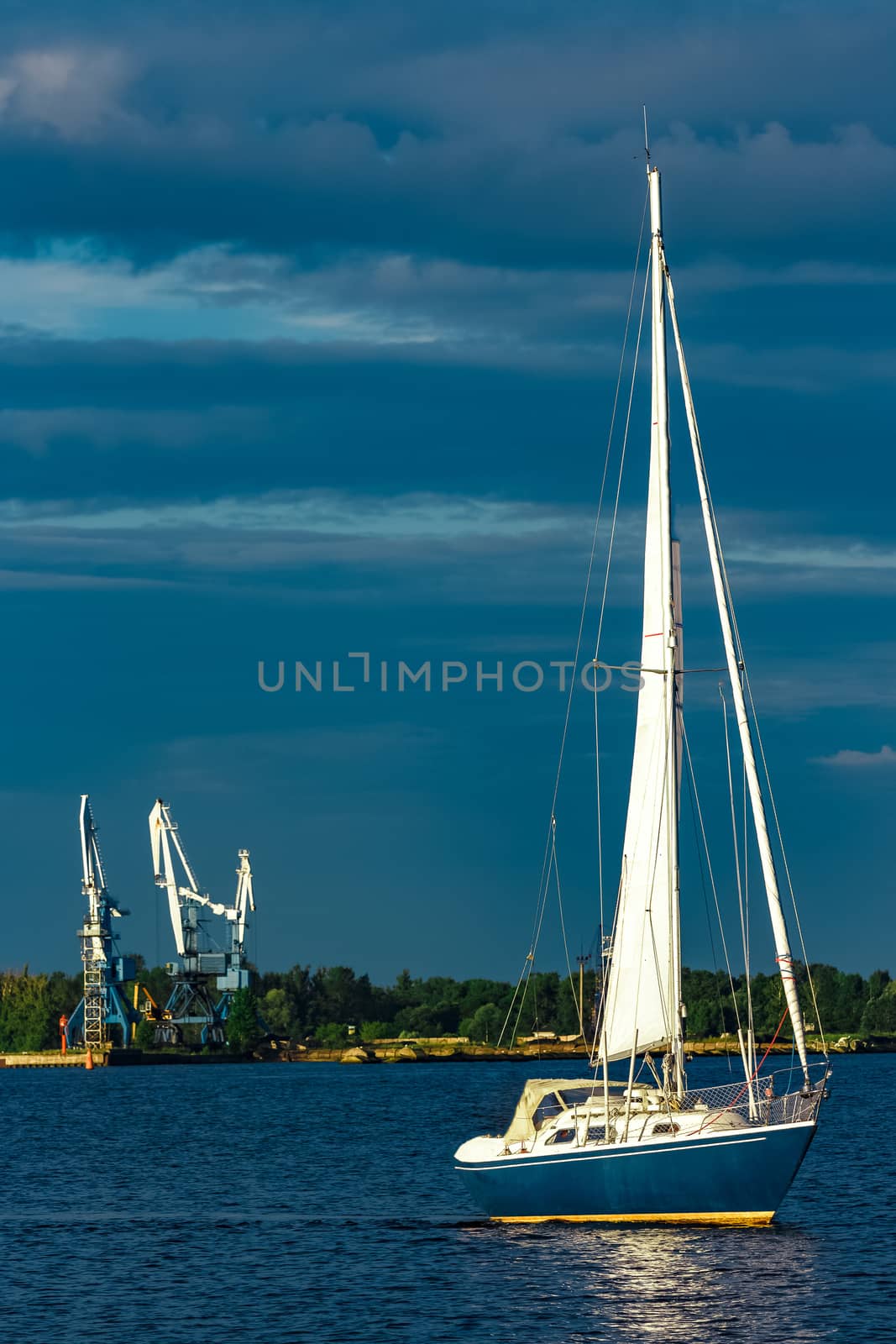 Blue sailboat in the travel by Europe. Sea journey