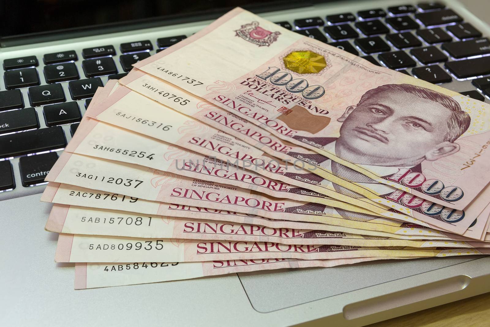 Singapore One Thousand Dollars Currency Notes on Computer by jpldesigns