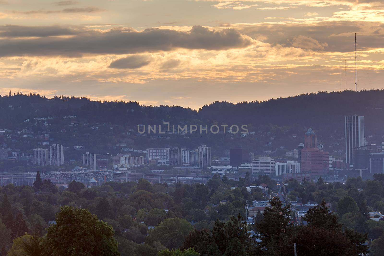 Portland Oregon city skyline by Marquam Bridge Freeway during sunset