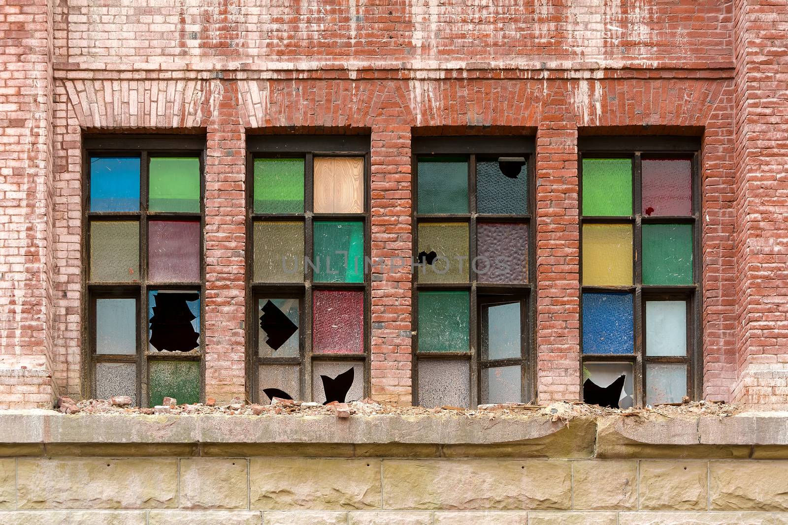 Broken Stained Glass Windows on Old Abandoned Brick Building by jpldesigns