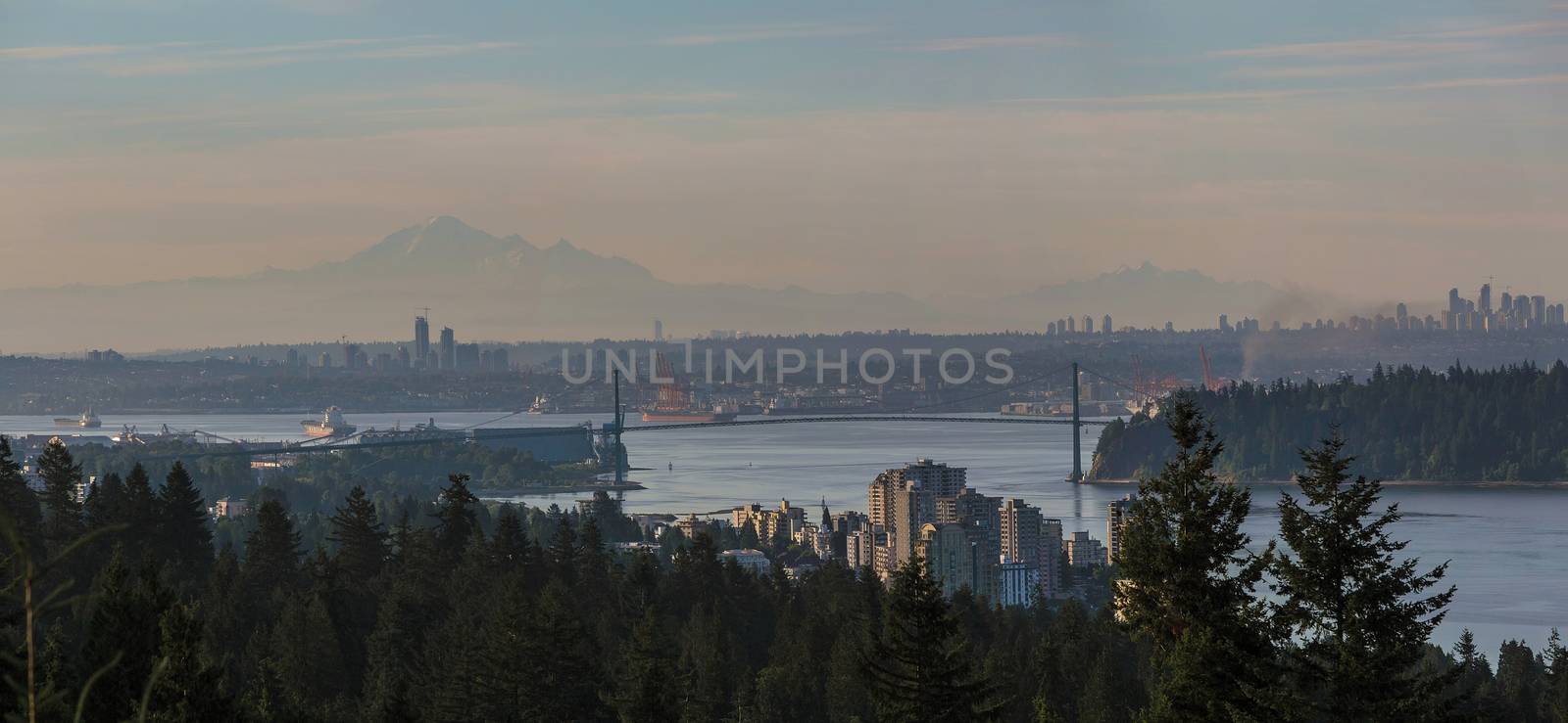 Morning view of Vancouver and Burnaby British Columbia Canada city skyline with Lions Gate Bridge and Stanley park Panorama