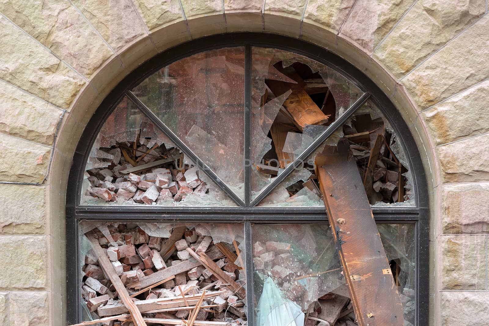 Arch Window filled with rubble of old building being demolished in downtown Portland Oregon