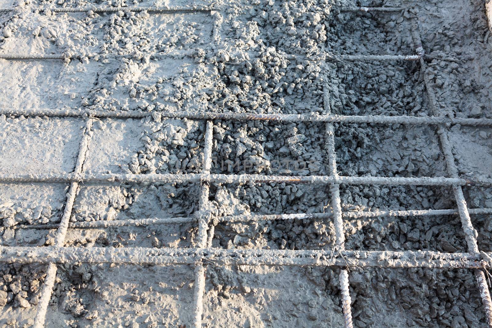 Closeup shot of construction site reinforcing metal bars of industrial floor