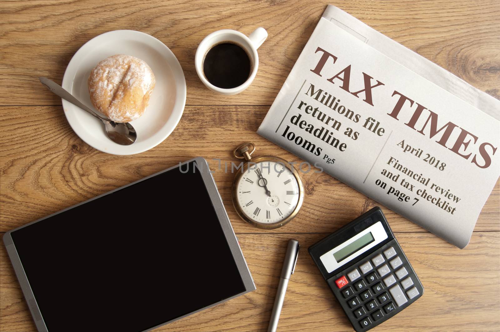 Tax times mock up newspaper with clock, calculator and tablet