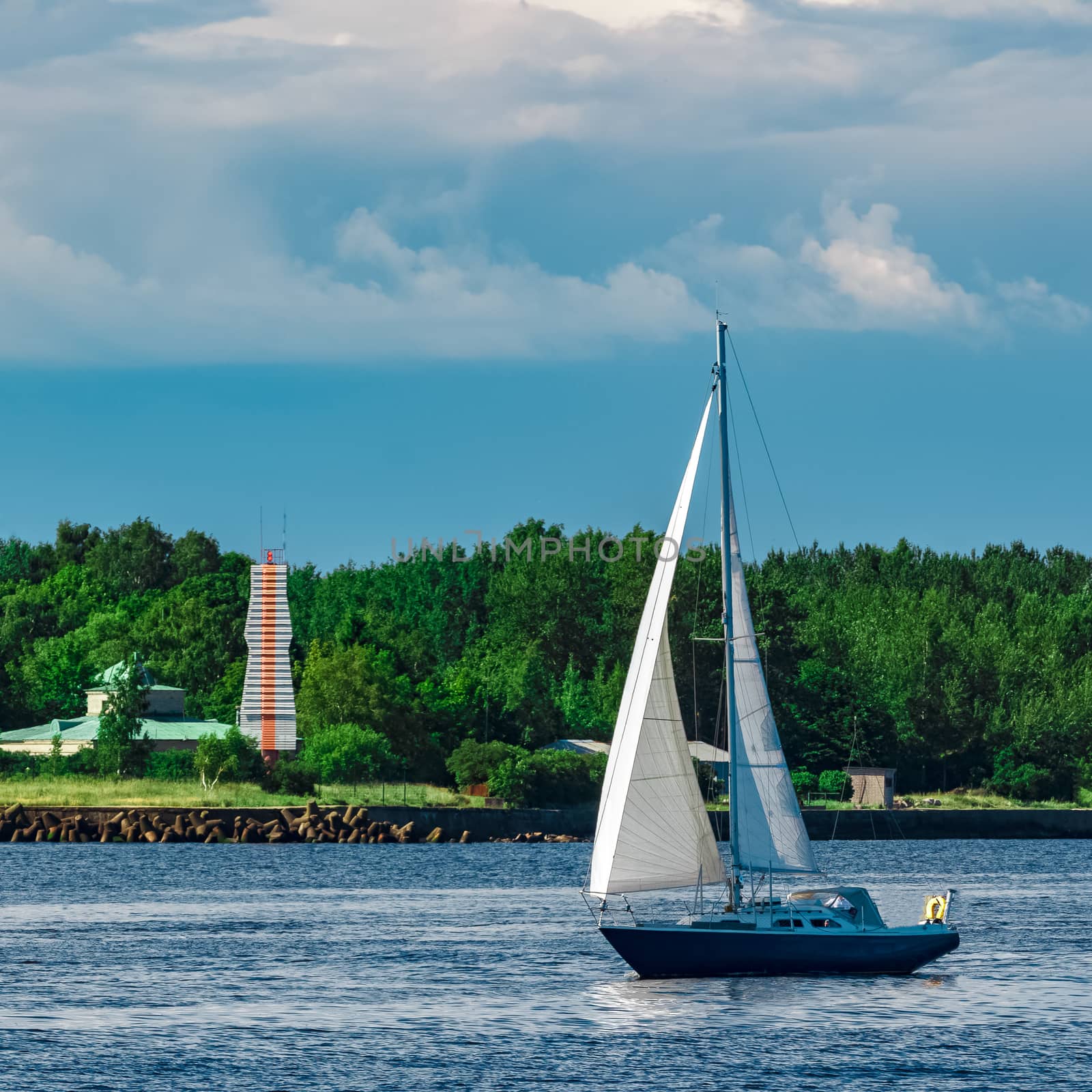 Blue sailboat at river by sengnsp
