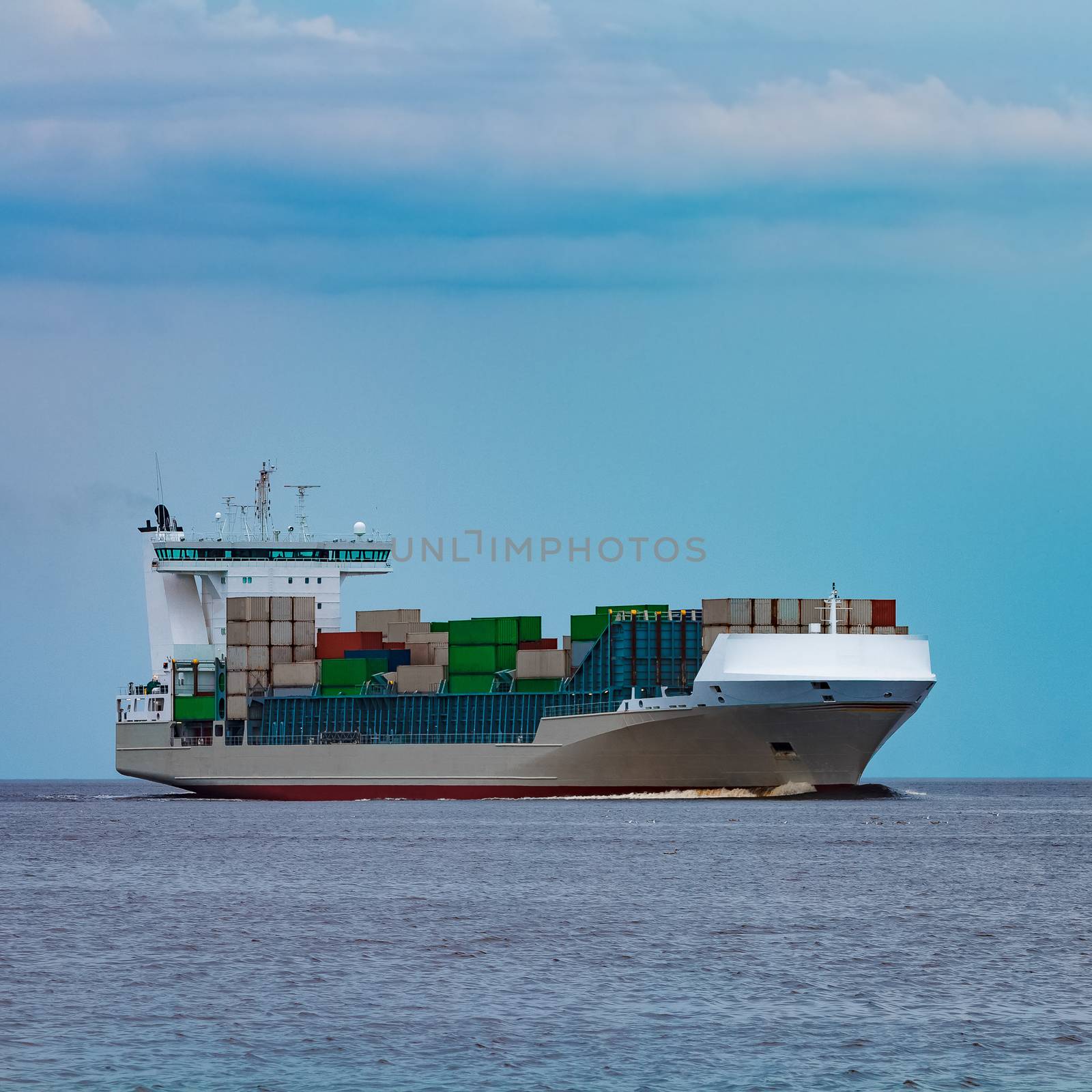 Grey container ship underway by sengnsp