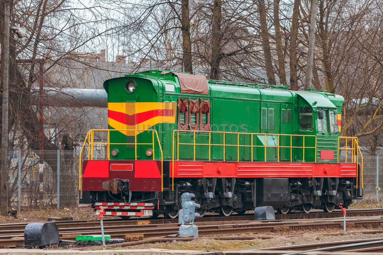 Green diesel cargo locomotive. Freight train in action