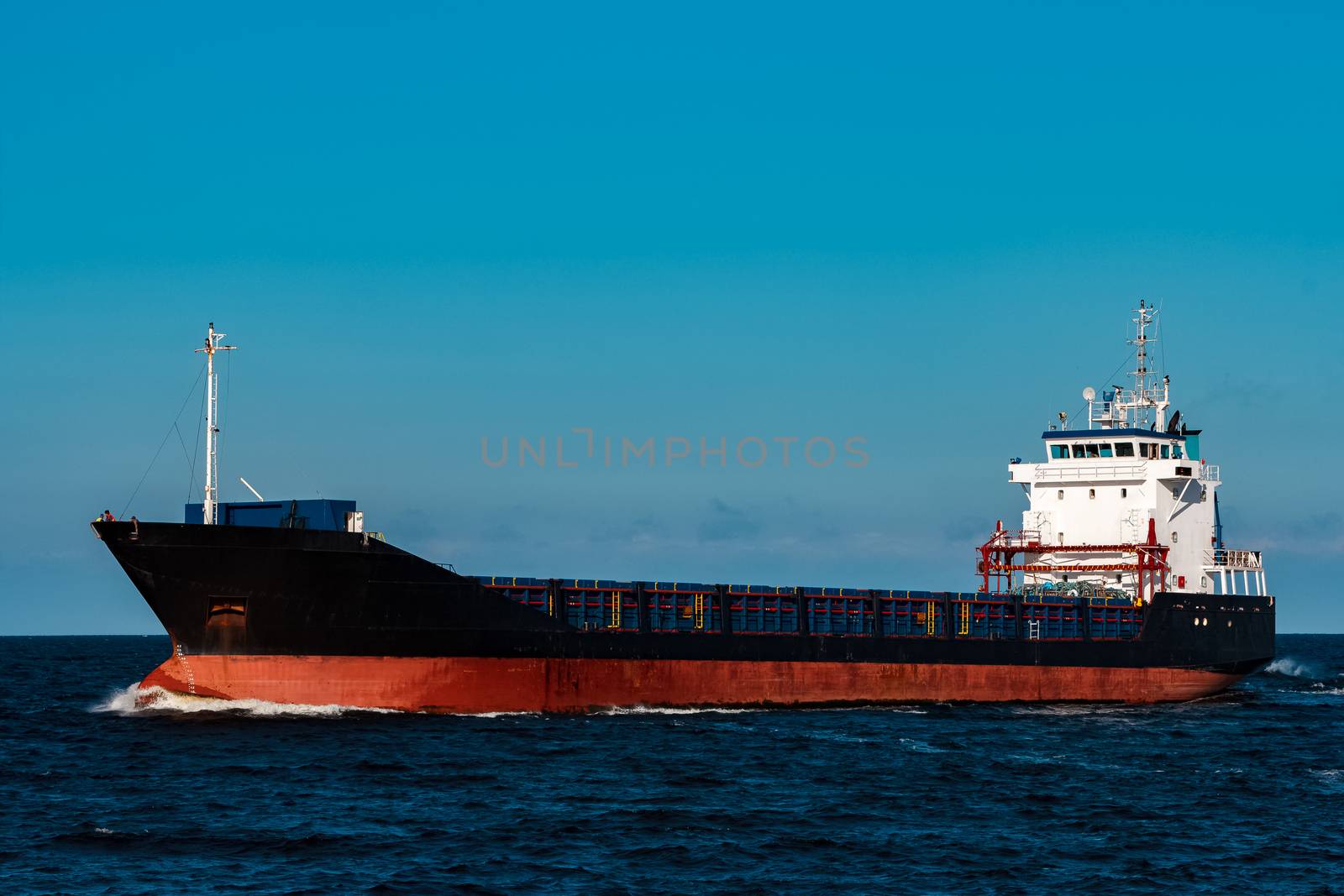 Black bulker ship. Logistics and merchandise transportations