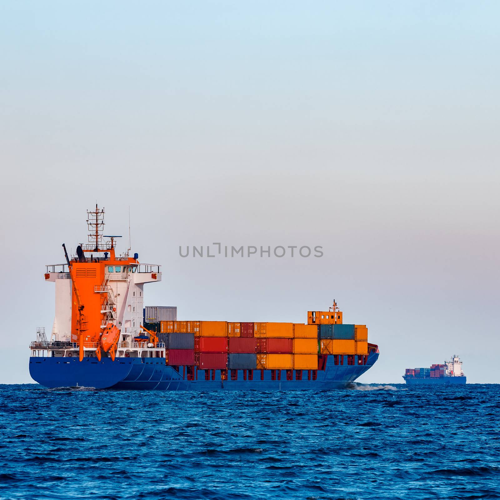 Blue container ship underway by sengnsp