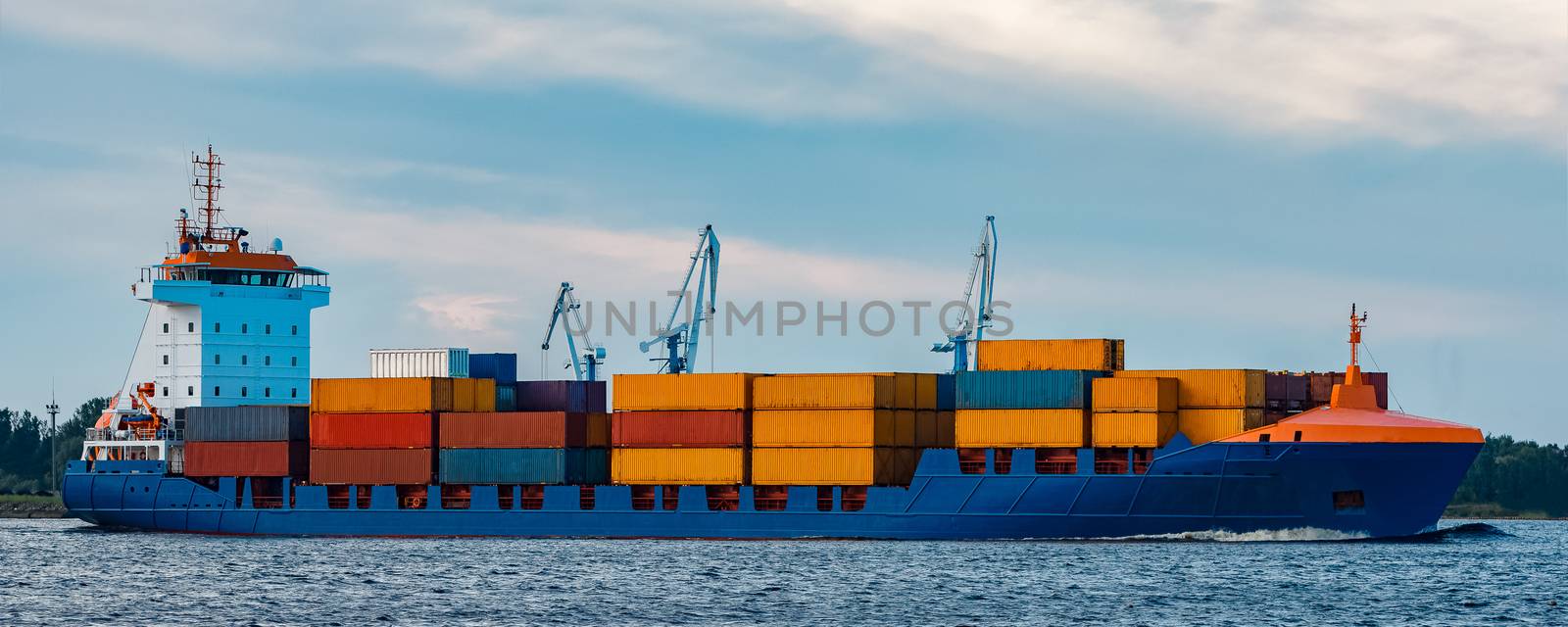 Blue container ship underway by sengnsp