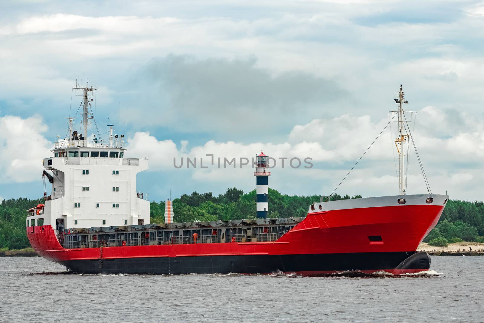 Red new cargo ship moving abroad. Product export in Europe