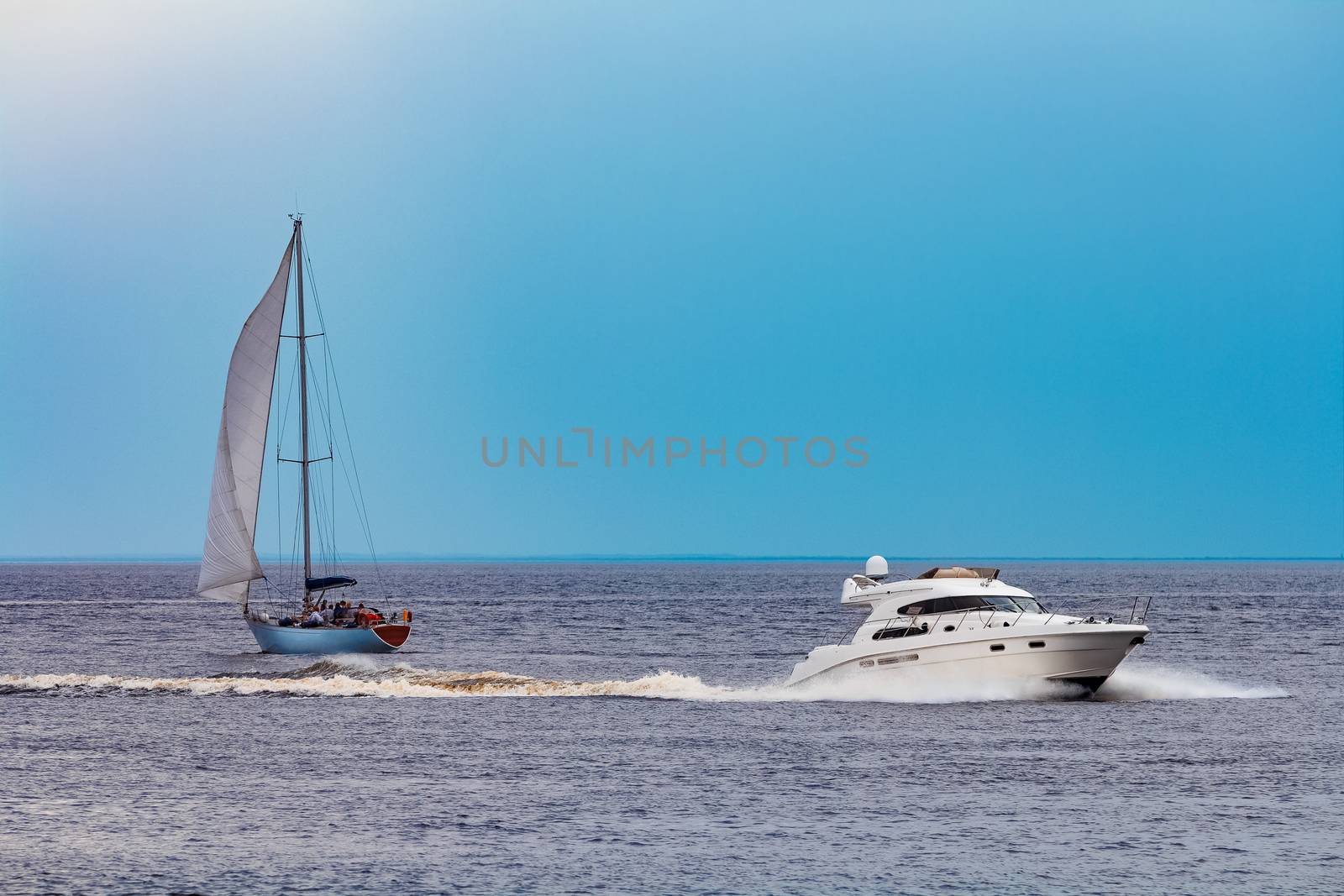 White speed boat moving fast to the Baltic sea. Water sport