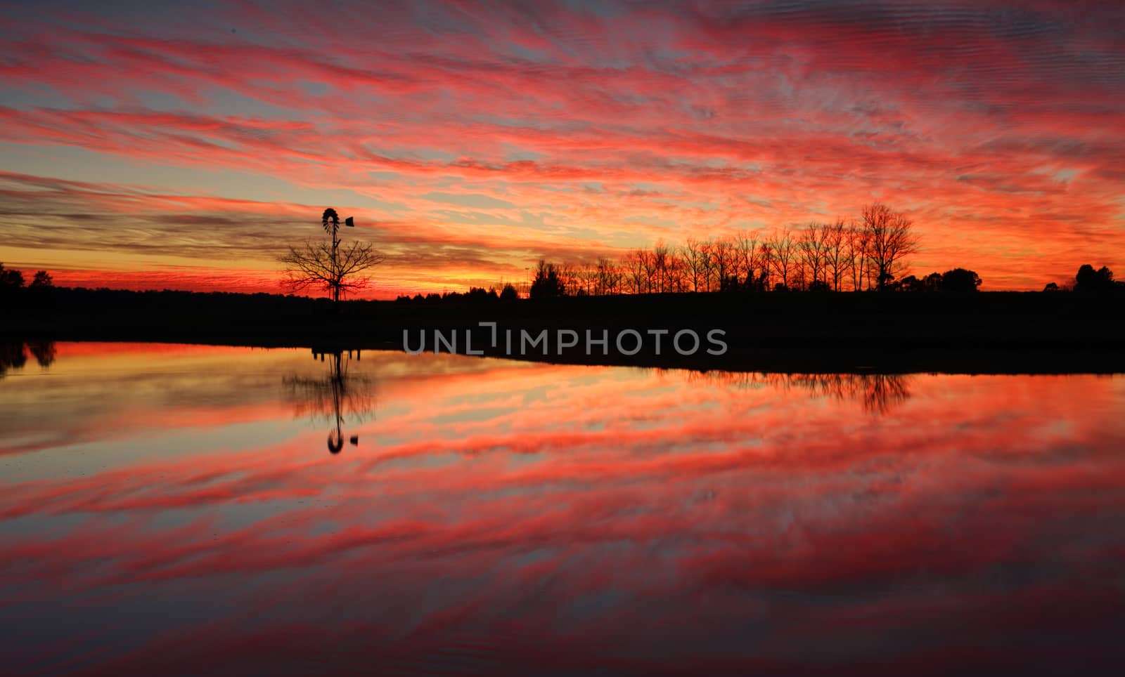 Sensational sunrise in rural Australia with reflections in farm dam