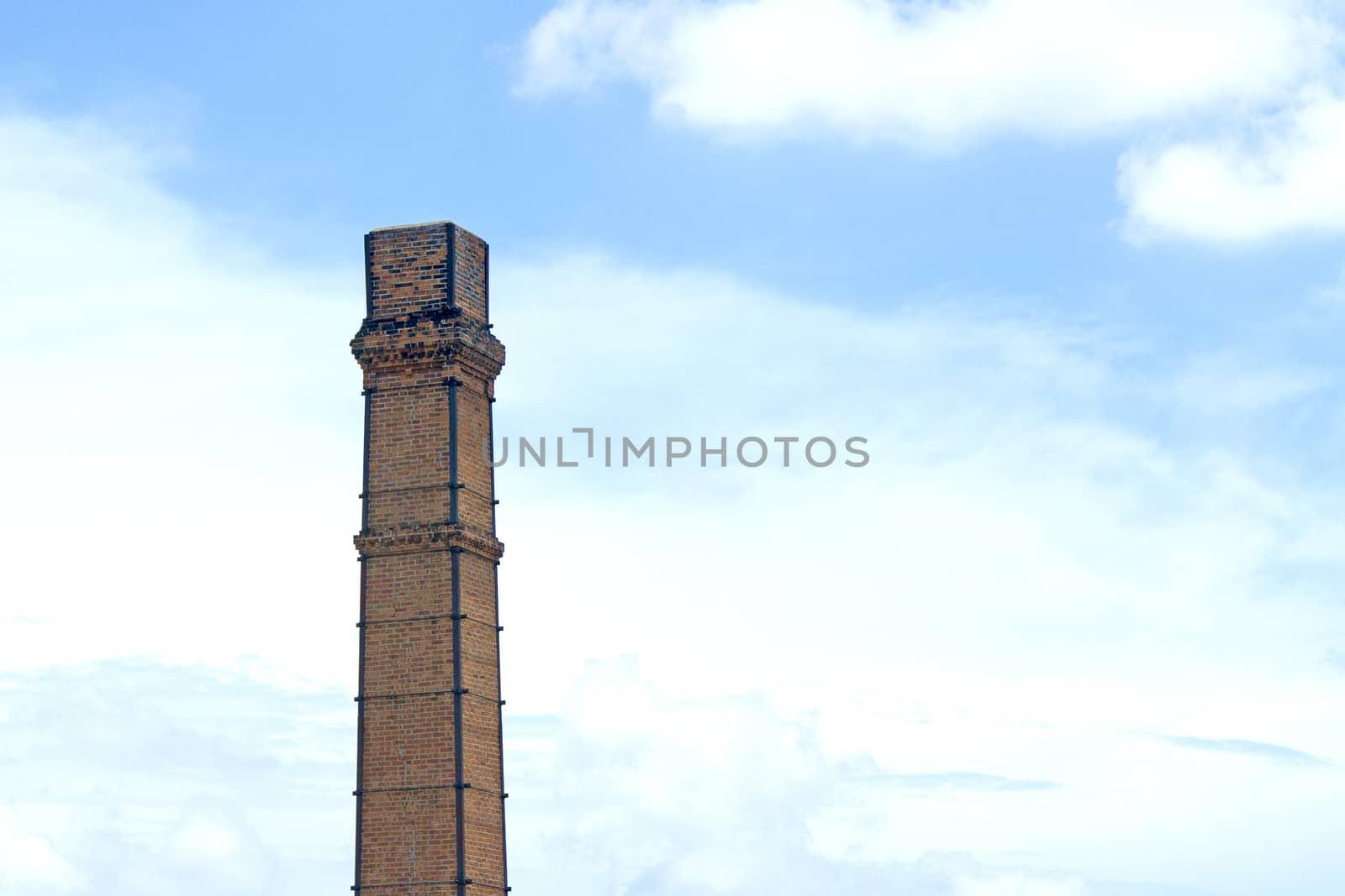 Old smokestack In the blue sky by TakerWalker