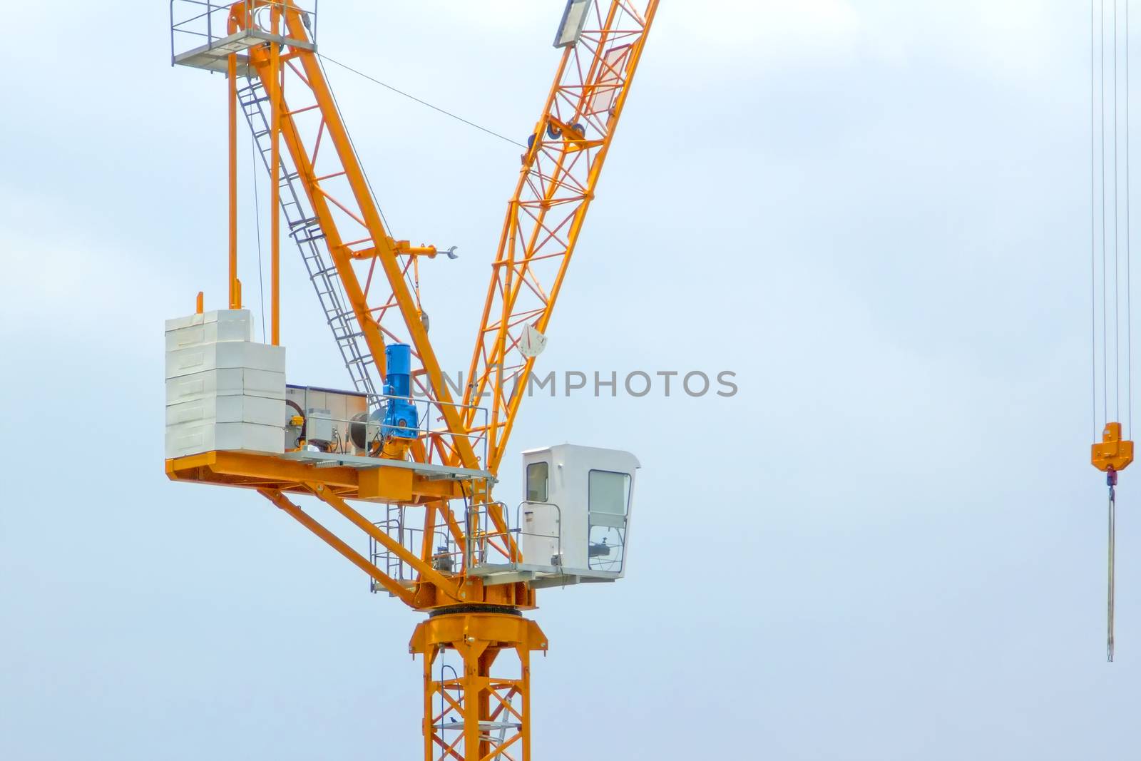 Yellow lifting crane Prepare to start In blue sky