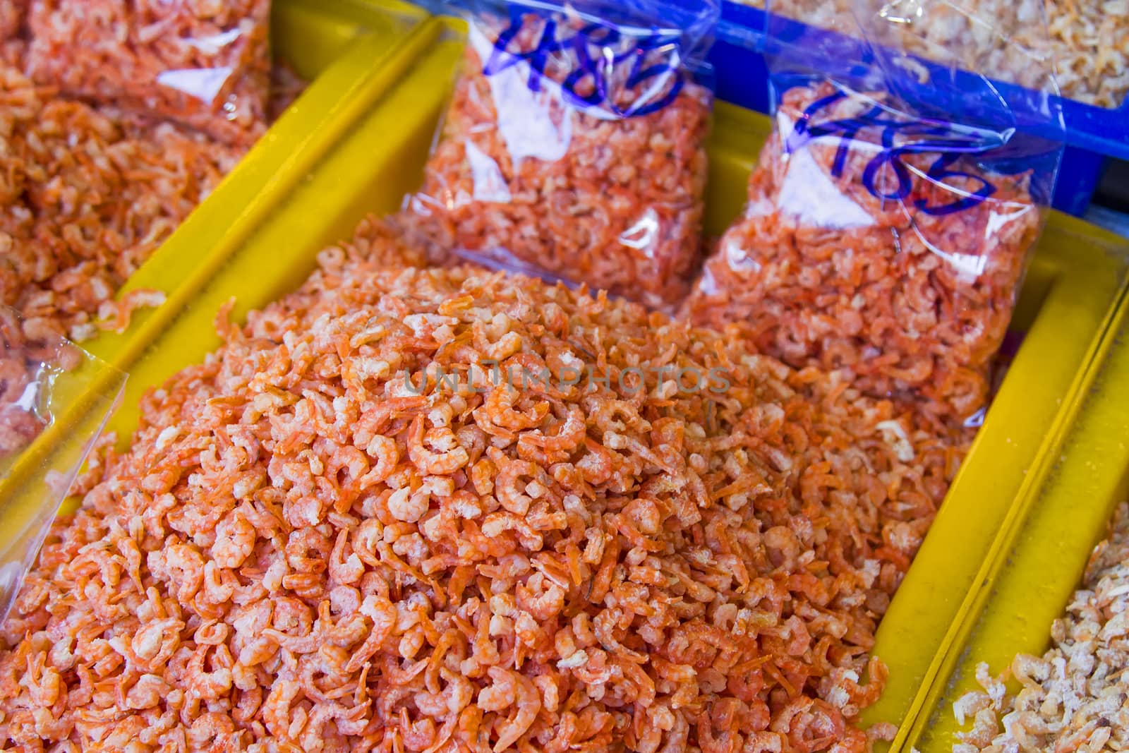 Dried shrimps of fresh orange is in the yellow pickup.