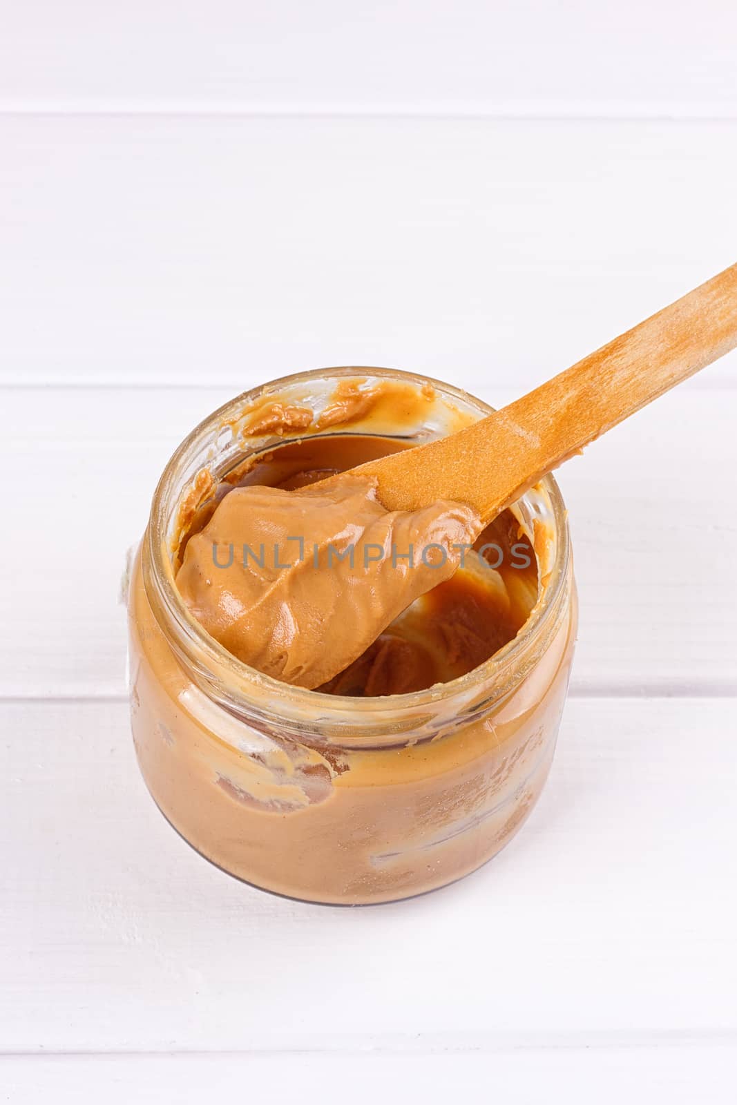 peanut butter with spoon by victosha