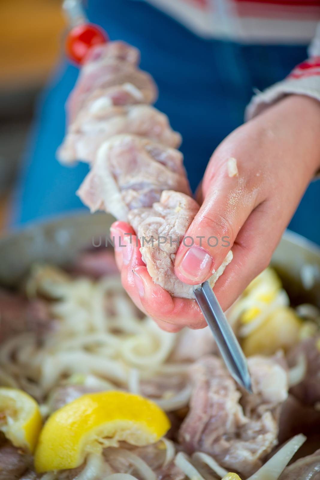 raw meat on a skewer before being sent to a fire close up by kosmsos111