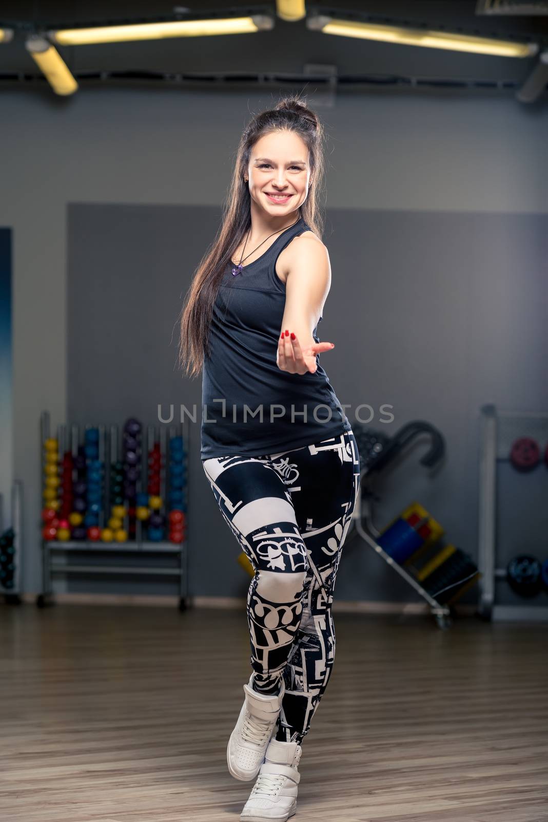 active young dancer during a dance in the gym by kosmsos111