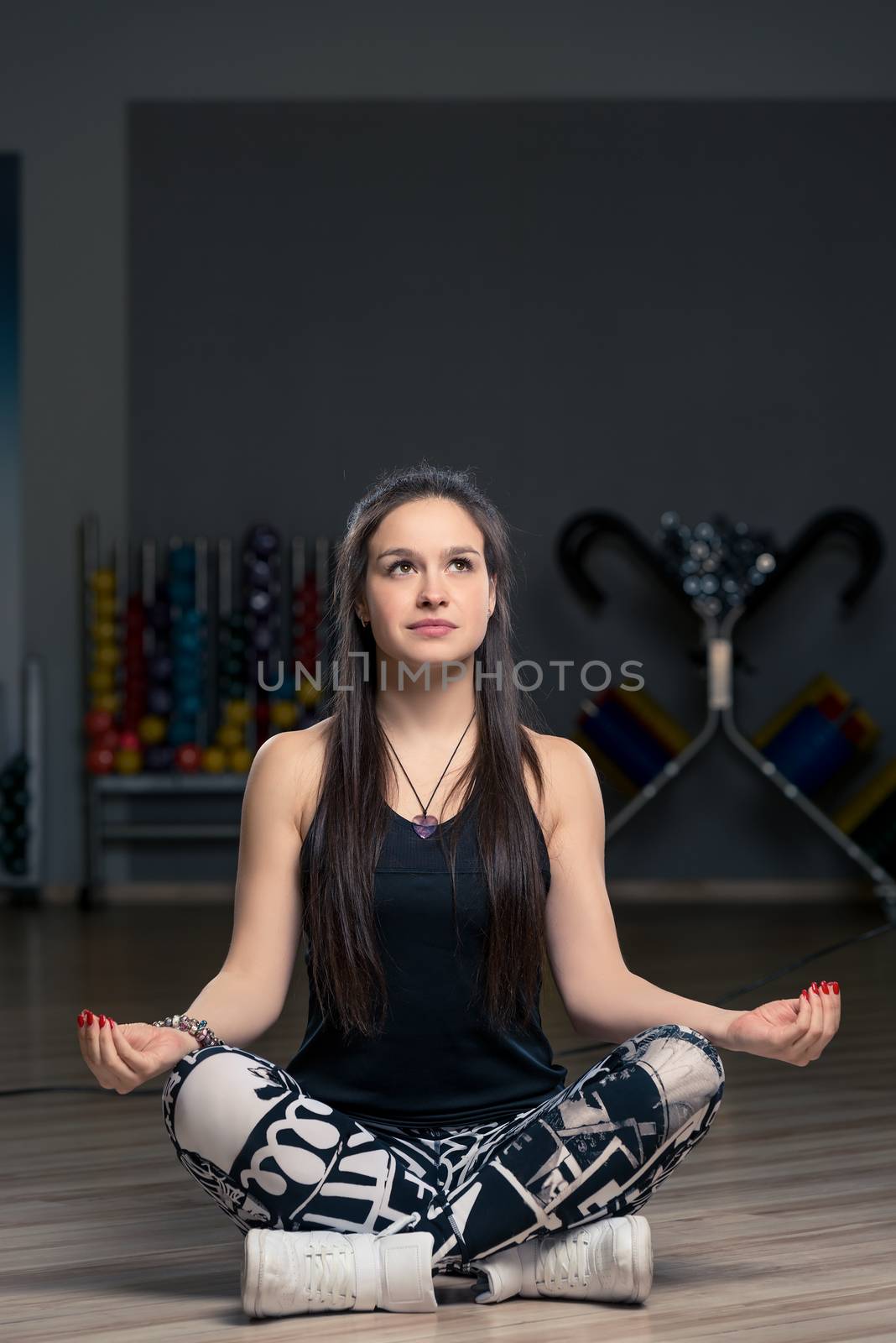 beautiful brunette doing yoga at the gym, lotus pose by kosmsos111