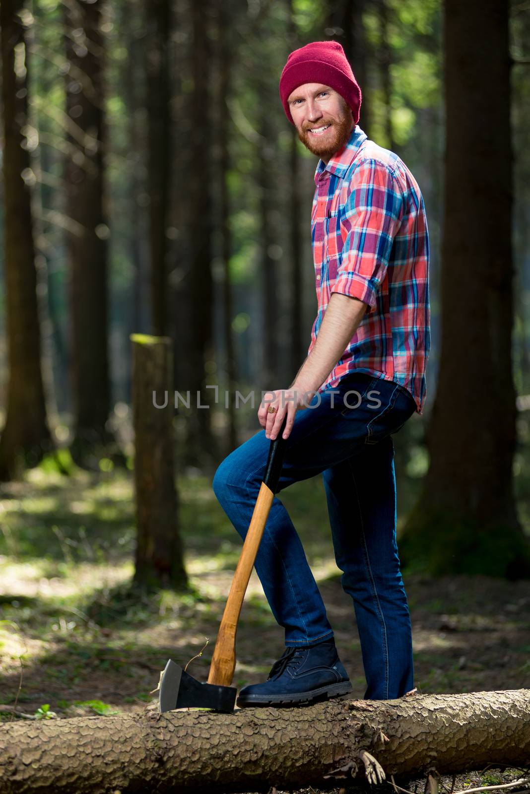 happy forester with an ax near a fallen tree posing by kosmsos111