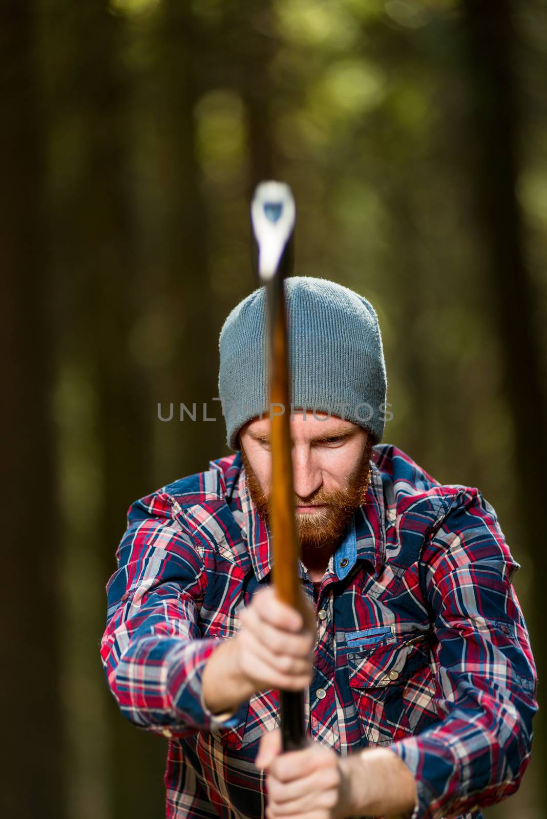 lumberjack chop wood with an ax in the woods by kosmsos111