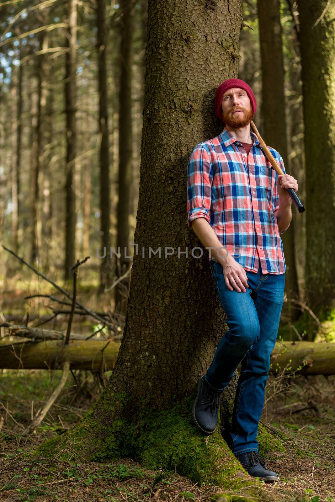 tired lumberjack with an ax resting, leaning against a tree by kosmsos111