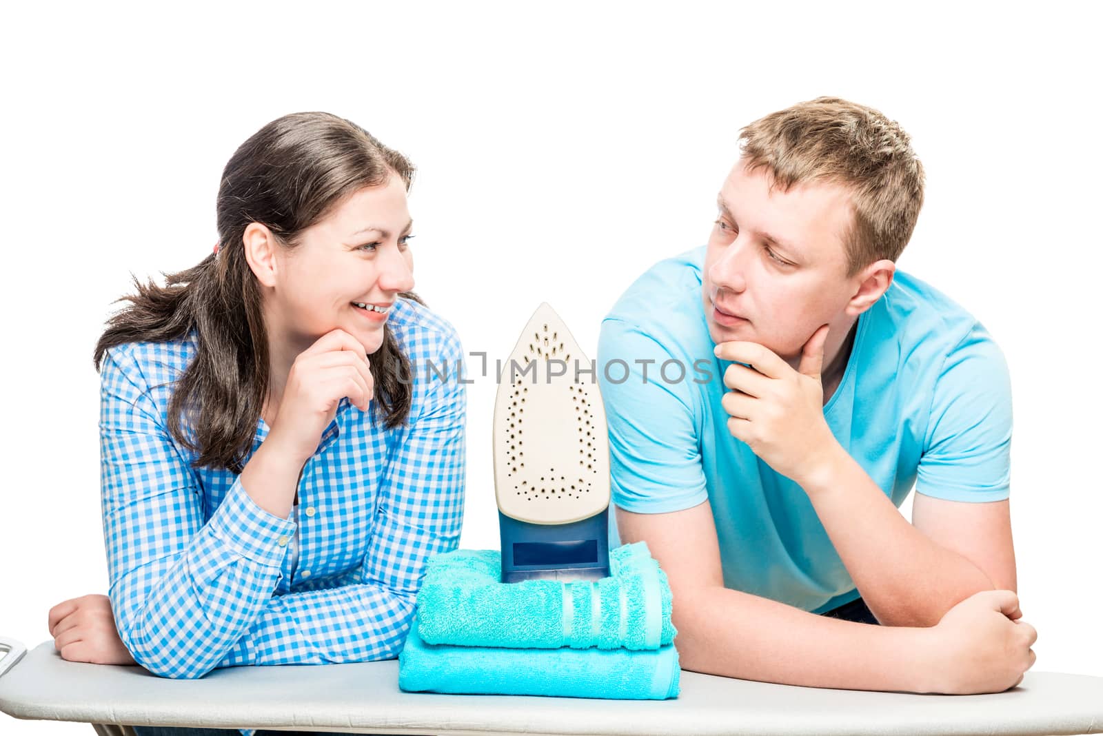 portrait of couple on background of ironing board, iron and towels isolated