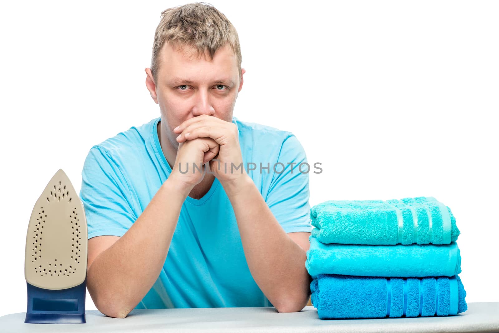 portrait of a distressed tired man with a bunch of ironed towels by kosmsos111