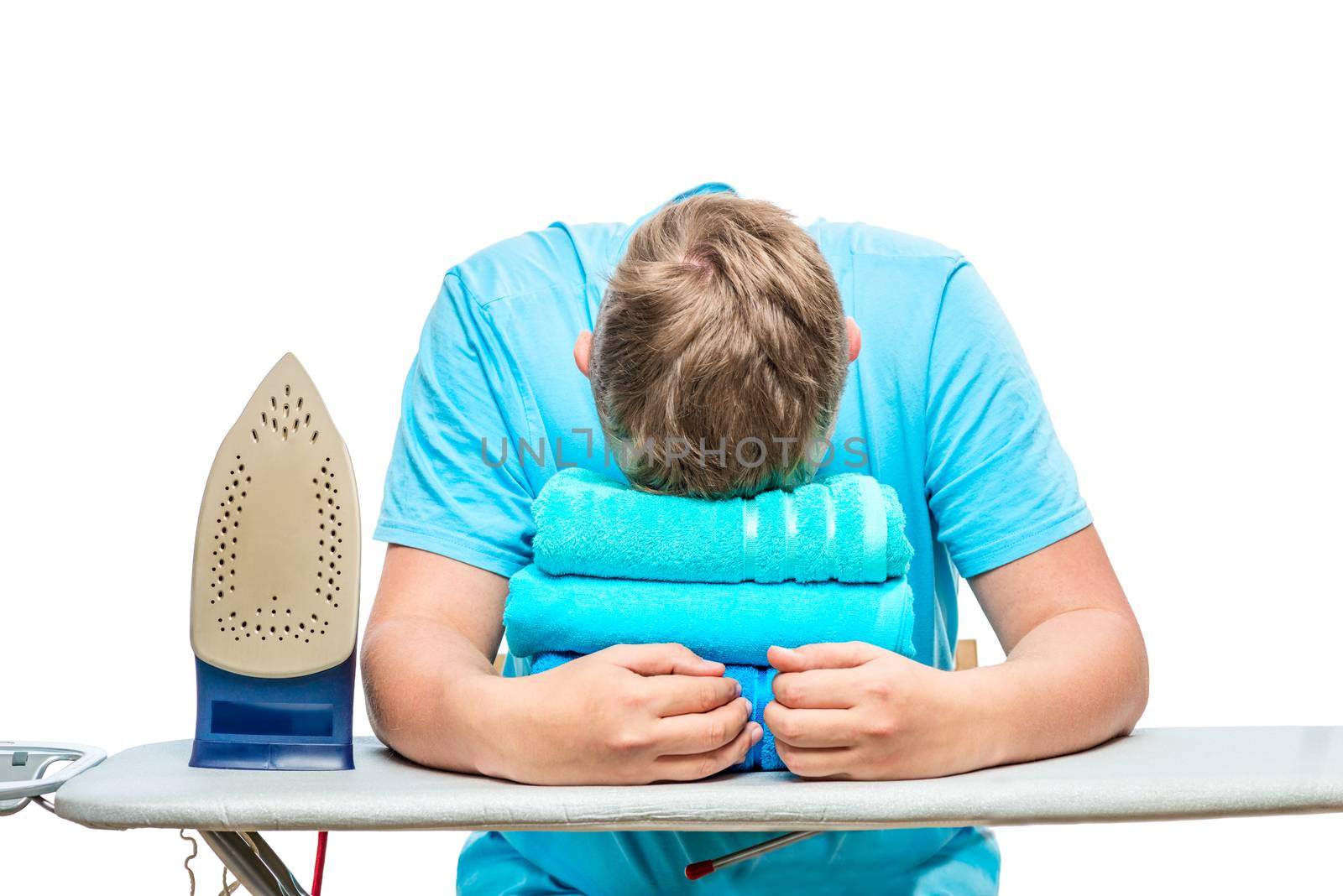 a very tired man fell asleep while ironing towels, a portrait is isolated