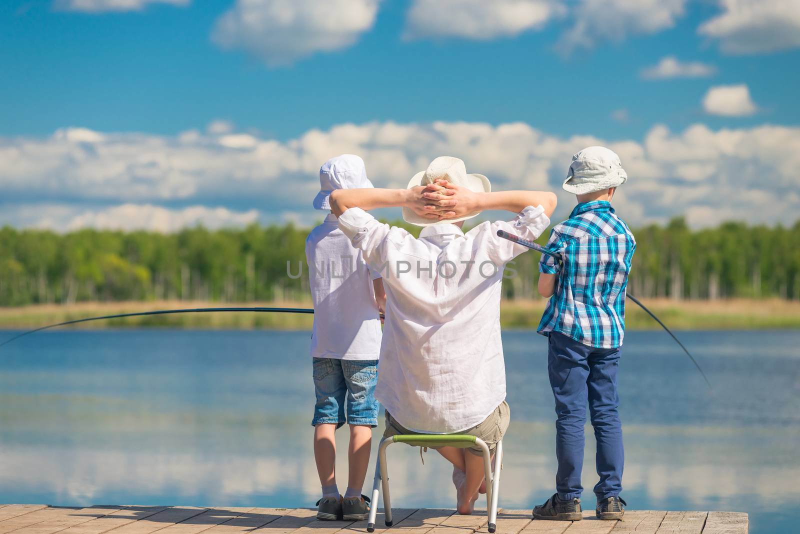 man and children 7 years fishing on a summer day