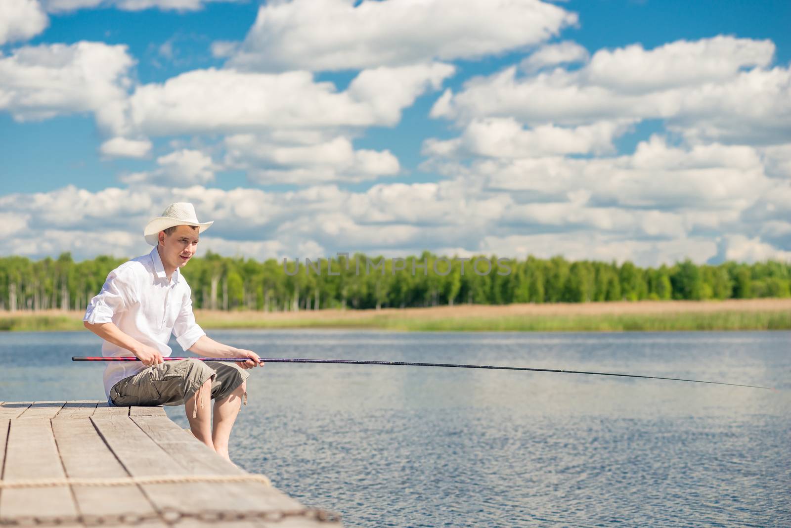 portrait of a fisherman in a hat on a wooden pier on a beautiful by kosmsos111