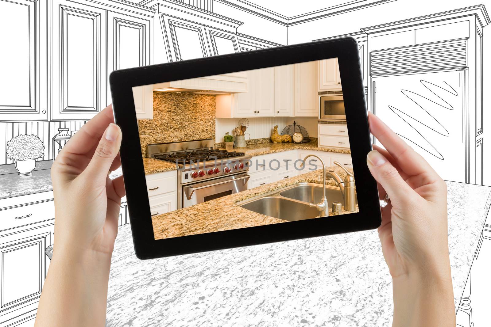 Female Hands Holding Computer Tablet with Kitchen on Screen &amp; Drawing Behind.