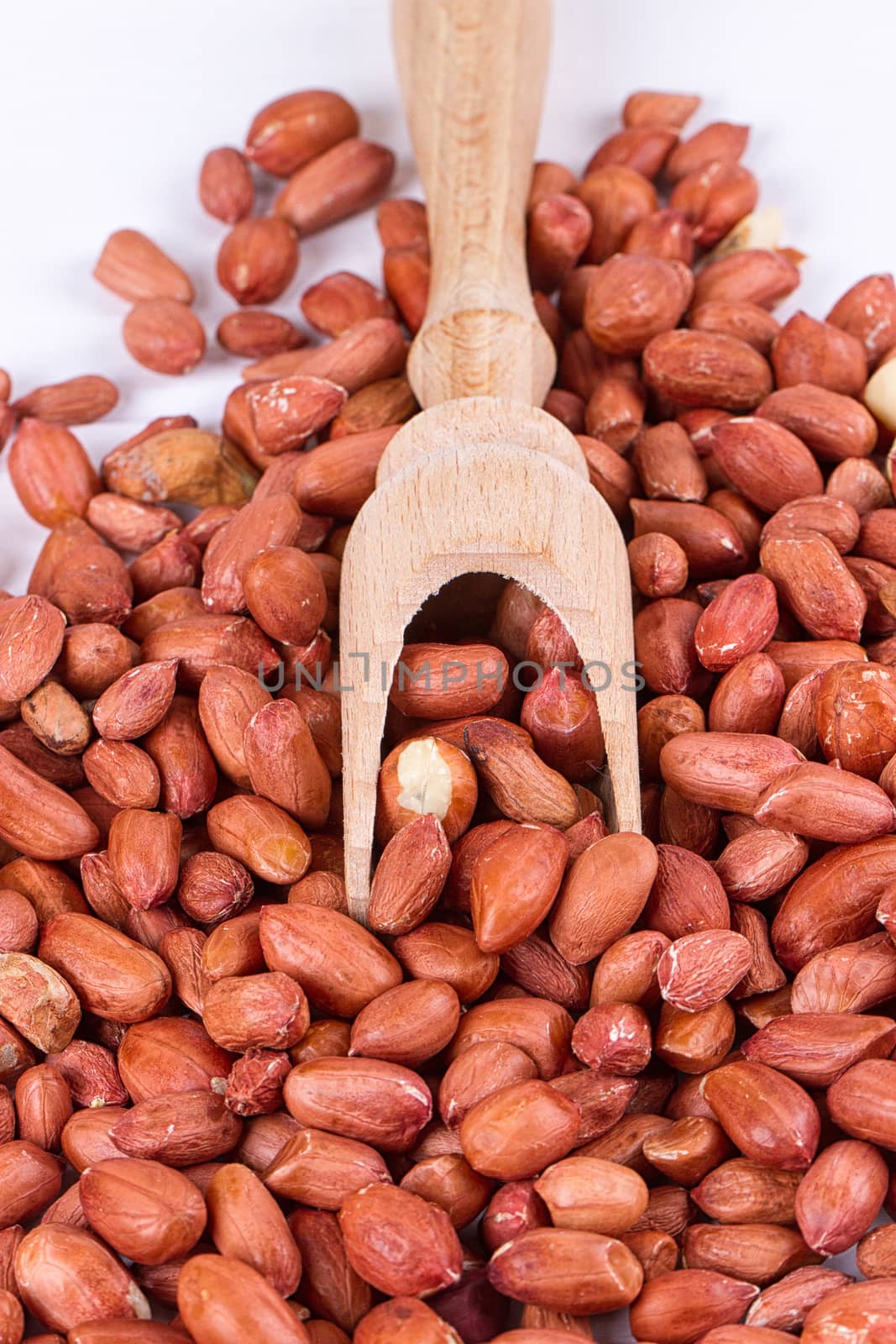 roasted peanuts with spatula close up photo