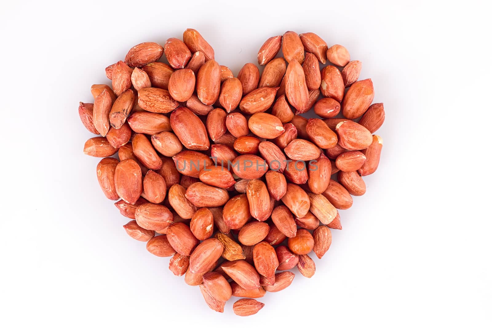 Peanuts in heart symbol isolated on white