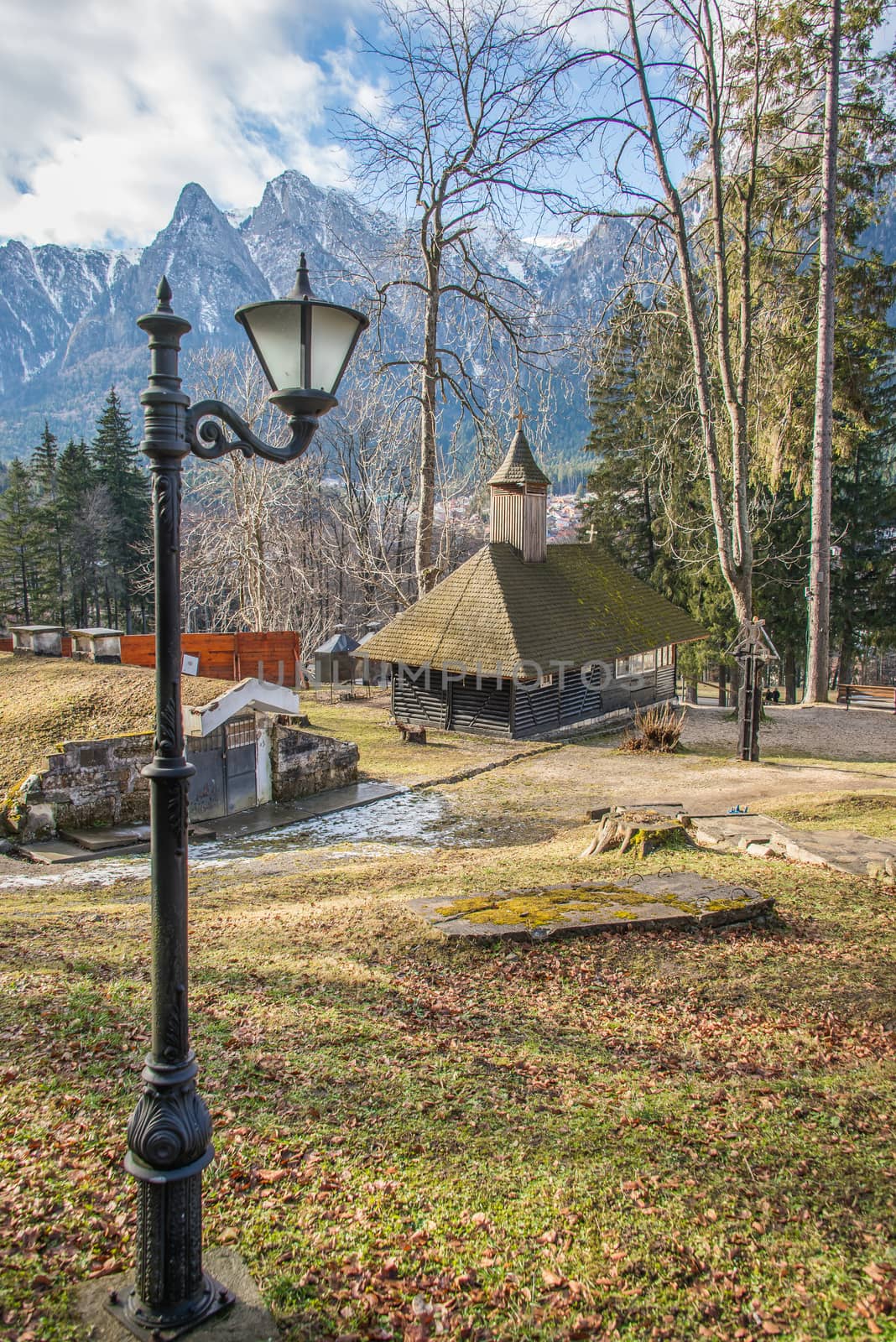 Cantacuzino Castle and the Carpathian Mountains in a sunny day. Residence and museum in a Transylvanian Busteni city, Romania