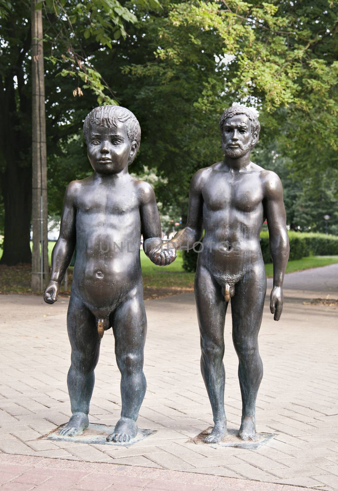 ESTONIA, TARTU - AUGUST 18, 2014 - Father and son sculpture by Goodday